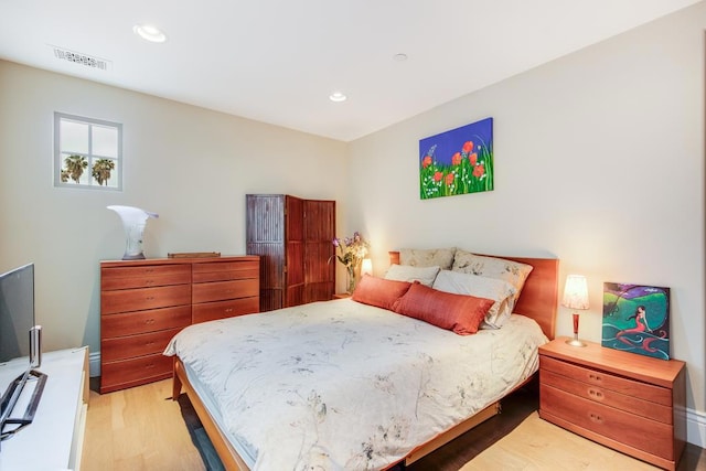 bedroom featuring light hardwood / wood-style floors