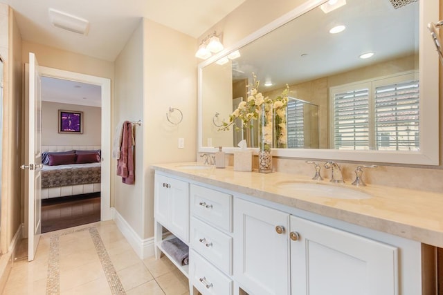 bathroom with vanity, tile patterned floors, and a shower with door