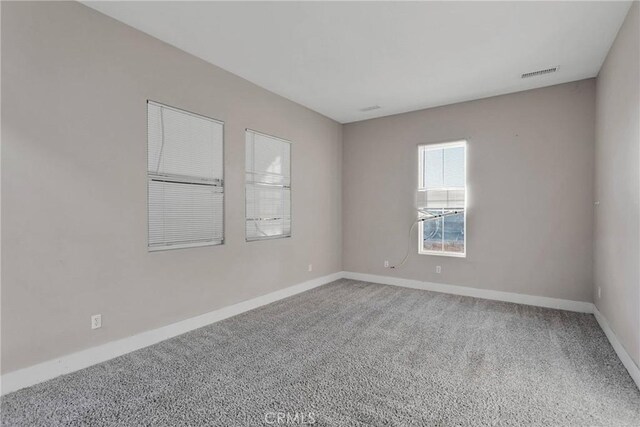 unfurnished room with carpet flooring