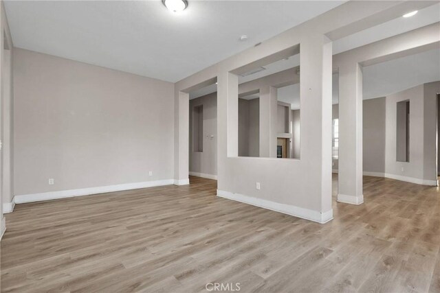 unfurnished living room with light wood-type flooring