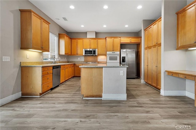 12573 Cabazon Ct, Apple Valley, CA 92308 - kitchen with light wood-style flooring, visible vents, baseboards, stainless steel appliances, and recessed lighting