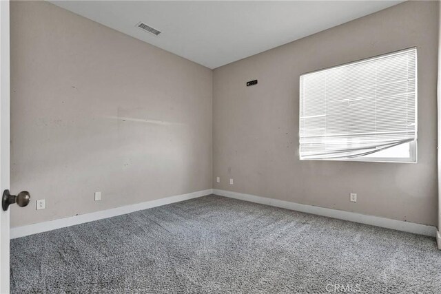 empty room featuring carpet flooring