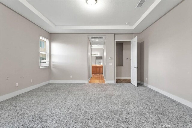 unfurnished bedroom featuring light carpet