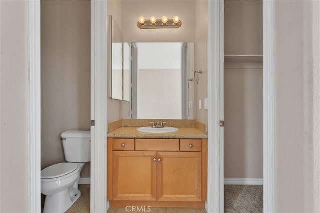 12573 Cabazon Ct, Apple Valley, CA 92308 - bathroom with toilet, vanity, and baseboards