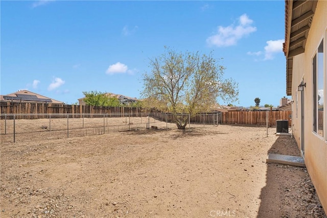 12573 Cabazon Ct, Apple Valley, CA 92308 - view of yard with a fenced backyard and central AC unit
