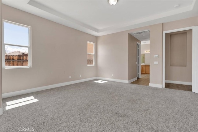 12573 Cabazon Ct, Apple Valley, CA 92308 - unfurnished bedroom with a raised ceiling, carpet floors, baseboards, and visible vents