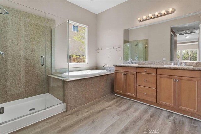 12573 Cabazon Ct, Apple Valley, CA 92308 - full bathroom featuring plenty of natural light, wood finished floors, and a sink