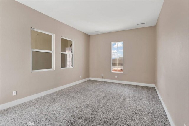 12573 Cabazon Ct, Apple Valley, CA 92308 - spare room with baseboards, visible vents, and carpet