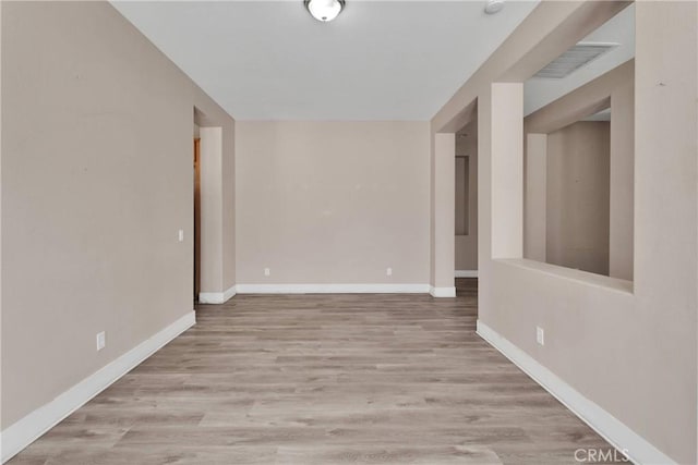 12573 Cabazon Ct, Apple Valley, CA 92308 - unfurnished room featuring baseboards, visible vents, and wood finished floors