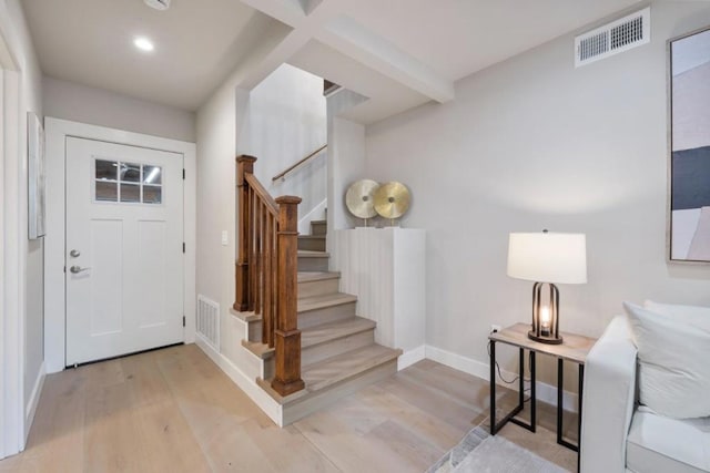 foyer entrance with light hardwood / wood-style flooring