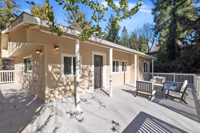 rear view of house featuring an outdoor living space