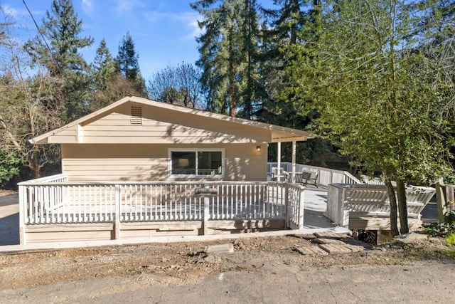 view of front of home with a wooden deck