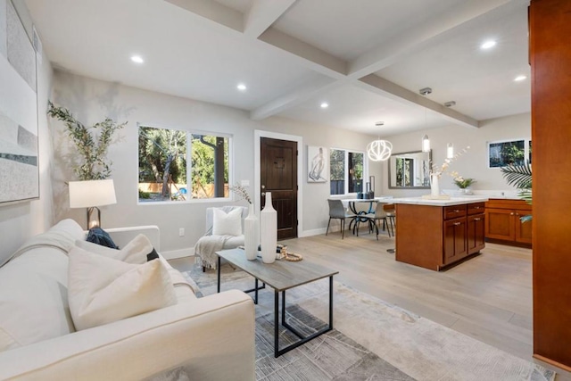 living room with light wood-type flooring and beamed ceiling