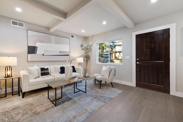 living room with light wood-type flooring and beamed ceiling