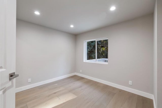 empty room with light hardwood / wood-style floors