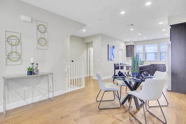 dining area with light hardwood / wood-style flooring