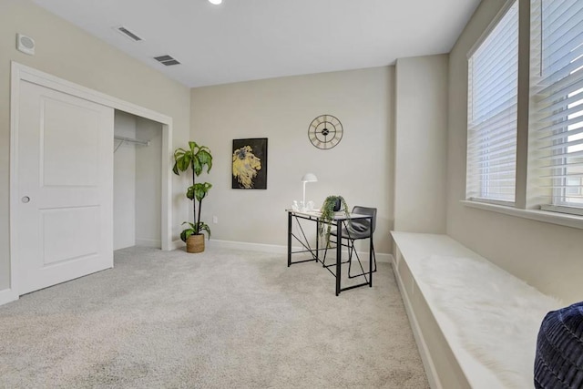 living area featuring light colored carpet