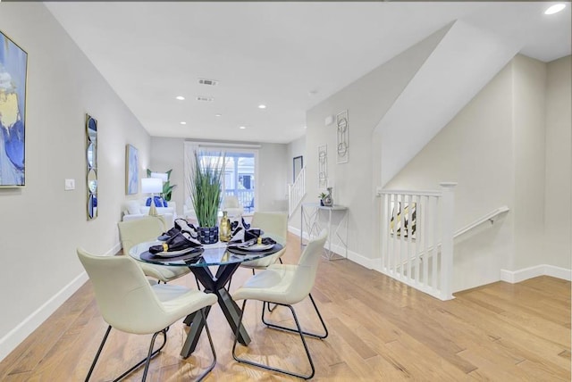 dining space with light wood-type flooring