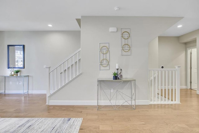 stairs featuring hardwood / wood-style flooring