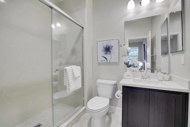 bathroom featuring tile patterned flooring, vanity, toilet, and a shower with door