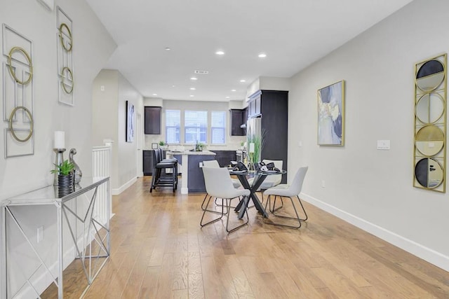 dining room with light hardwood / wood-style floors