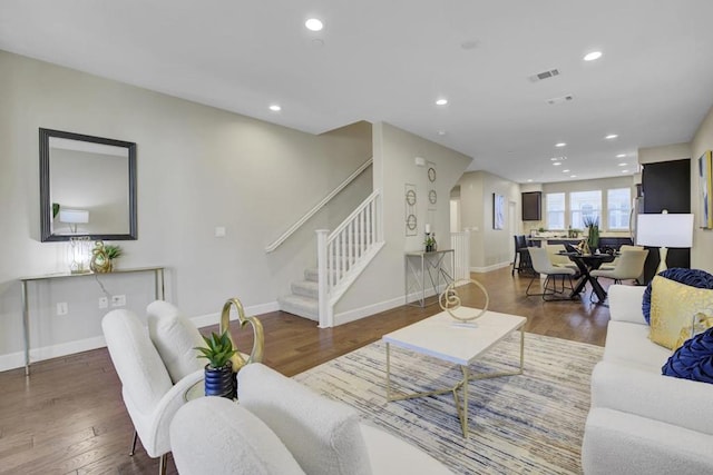 living room featuring dark wood-type flooring