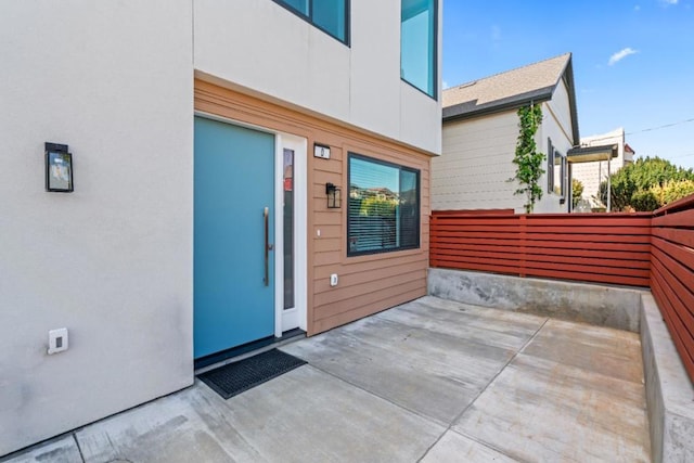 property entrance featuring a patio area