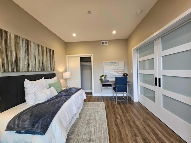 bedroom featuring dark hardwood / wood-style floors and a closet