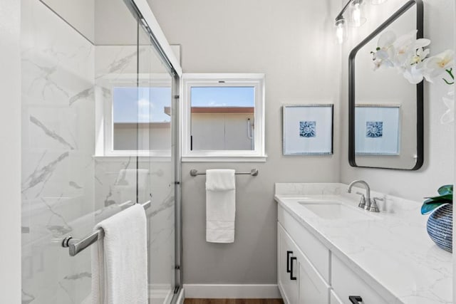 bathroom with vanity and an enclosed shower