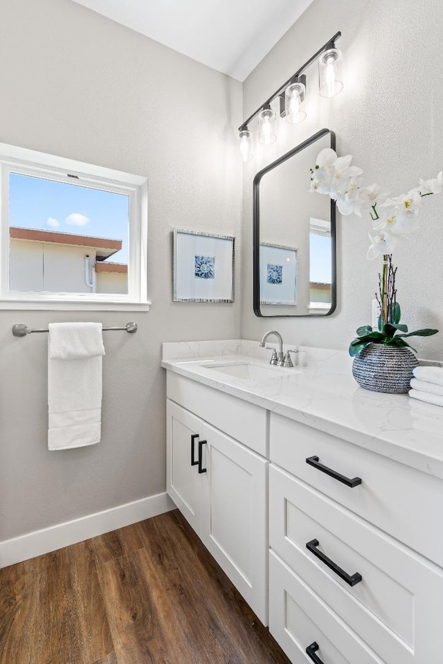 bathroom featuring vanity and hardwood / wood-style flooring