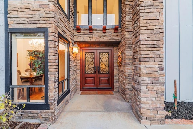 property entrance featuring french doors