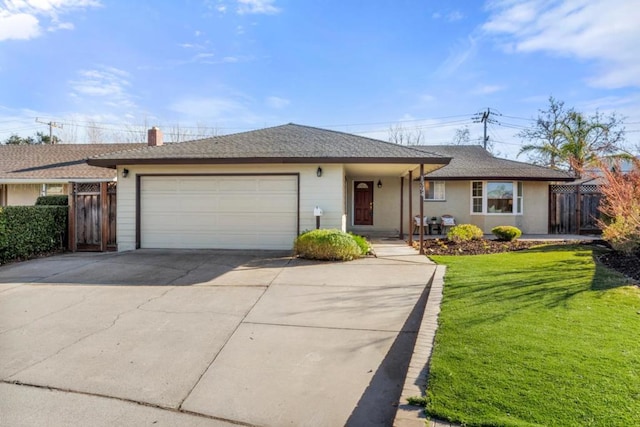 single story home featuring a garage and a front yard