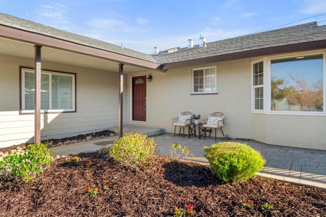 property entrance with a patio