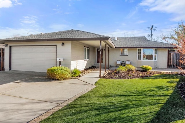 ranch-style home with a front yard and a garage