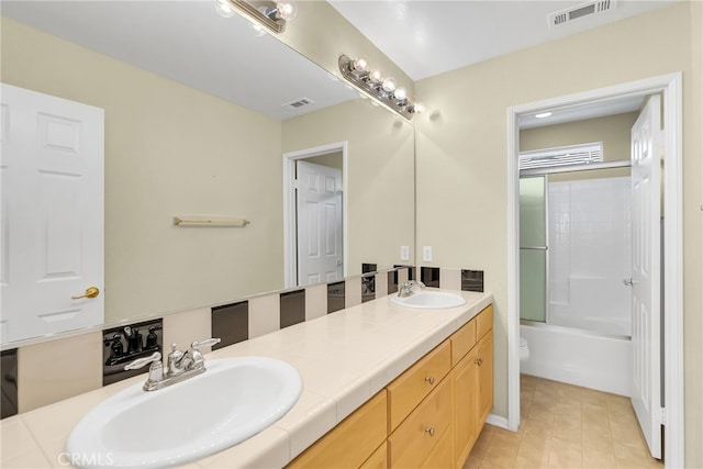 full bathroom with toilet, combined bath / shower with glass door, tile patterned flooring, and vanity