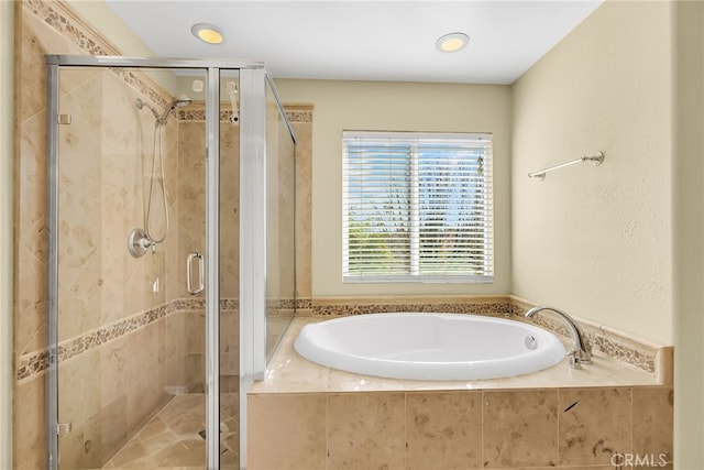 bathroom with separate shower and tub