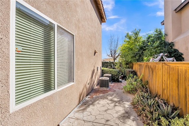 view of side of home with a patio