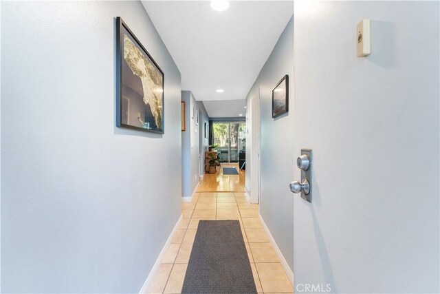 hallway featuring light tile patterned floors