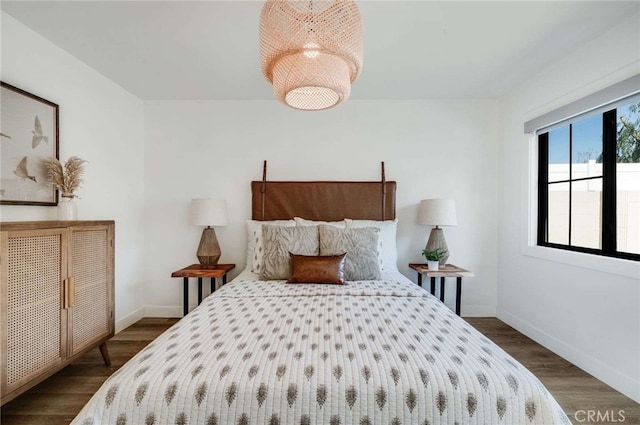 bedroom featuring dark wood-type flooring