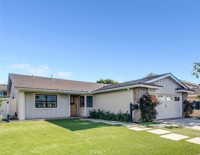 single story home featuring a garage and a front lawn