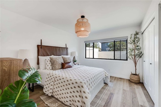 bedroom with light hardwood / wood-style flooring