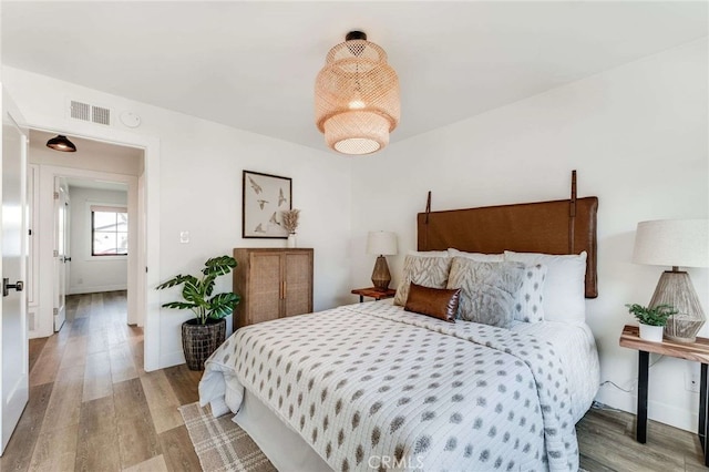 bedroom featuring wood-type flooring