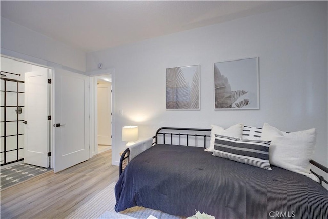 bedroom featuring wood finished floors