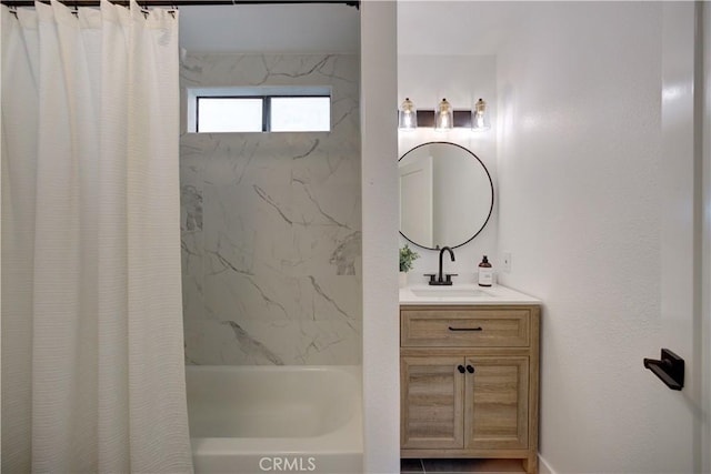 full bathroom featuring shower / bath combo with shower curtain and vanity