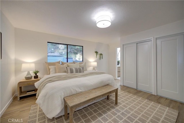 bedroom with light hardwood / wood-style floors