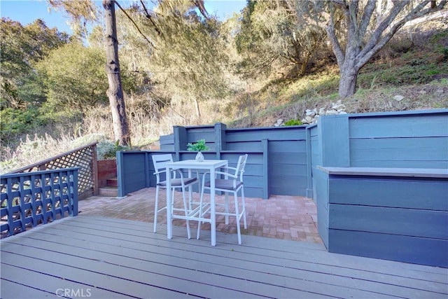 deck featuring outdoor dining area