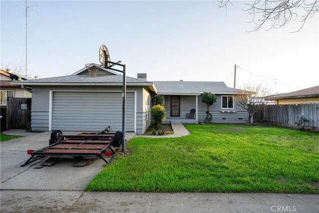 view of front of home with a garage and a front yard