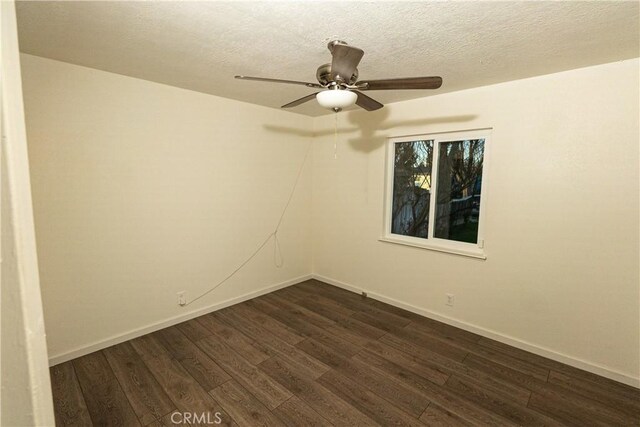 unfurnished room featuring a textured ceiling, dark hardwood / wood-style floors, and ceiling fan