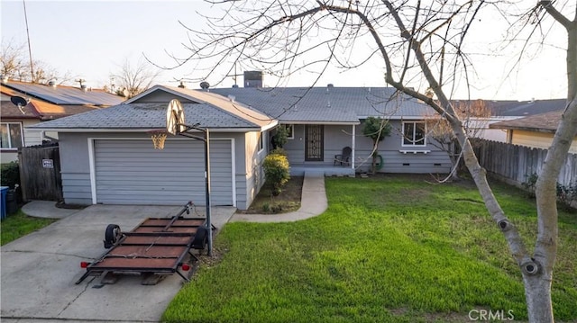 view of front of property featuring a garage and a front lawn