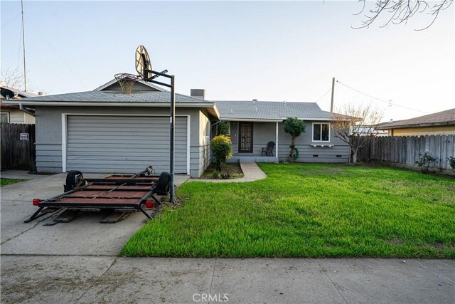 view of front facade with a garage and a front lawn